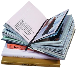 An open book resting on a stack of books