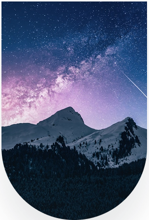 Starry night sky over mountains