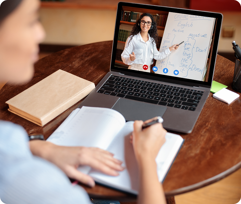 Student in an online tutoring video call on a laptop